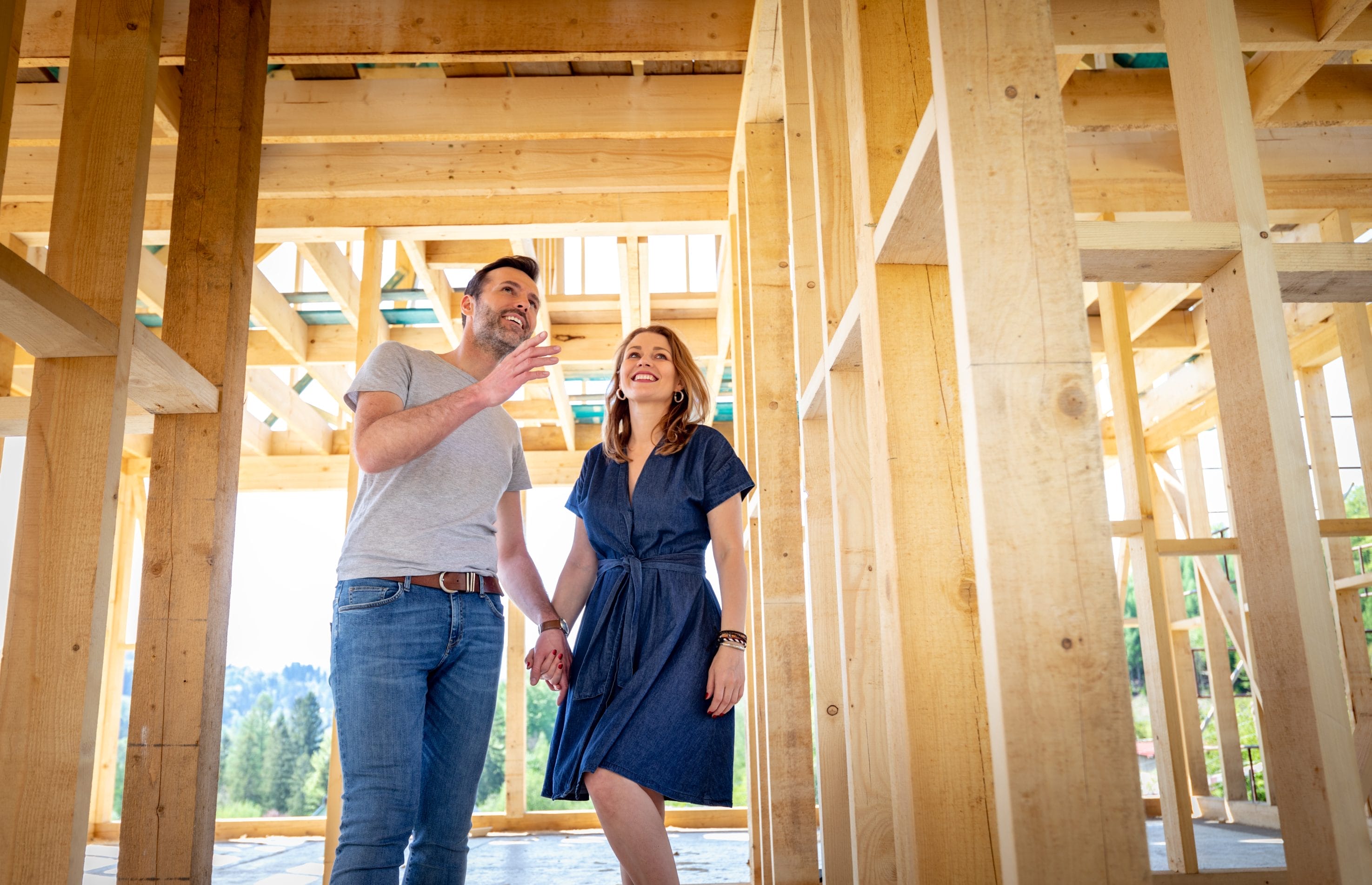 Couple Inspecting Framed Commercial Building with Radon Mitigation For Constructions
