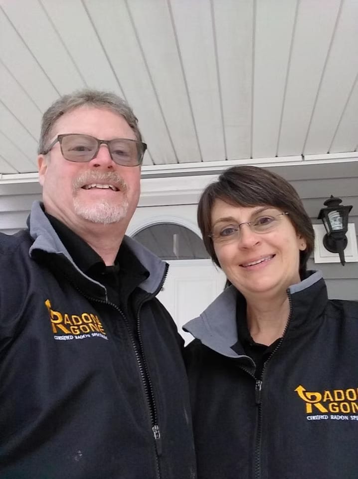 Radon Gone Professionals Smiling in Uniform
